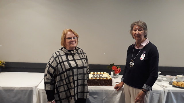 M.E.G. Inc. President Denyse Gormley & Life Member & Past President Barbara Horn who spoke of the Group’s history
before cutting the cake.